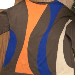 Front multi colored and back solid. 3/4 sleeve